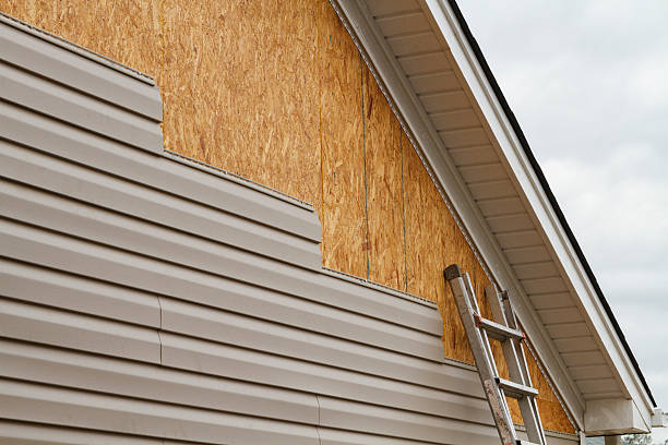 Professional Siding technician working in Massey, MD